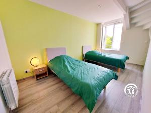 Ένα ή περισσότερα κρεβάτια σε δωμάτιο στο Les Grands Blés d'Or, 12 personnes