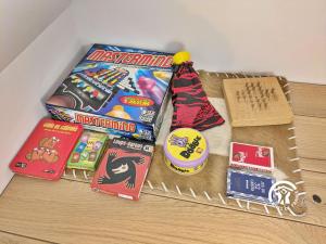 a table with games and board games on it at La Janvrie, 5 personnes in La Rouaudière +30 photos