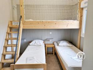 Ένα ή περισσότερα κρεβάτια σε δωμάτιο στο Chalet Le Brochet