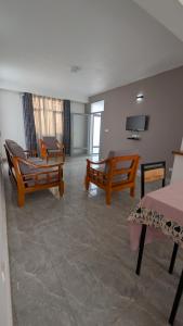 TV a/nebo společenská místnost v ubytování Bitare Appartements