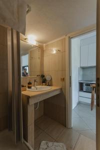 Kuchyň nebo kuchyňský kout v ubytování Garnet Studio Flats + 37 fotografií