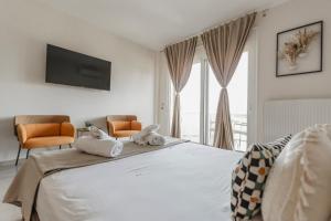Postel nebo postele na pokoji v ubytování Garnet Studio Flats