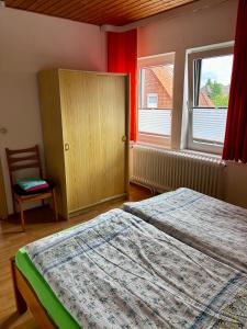 Ein Bett oder Betten in einem Zimmer der Unterkunft Ferienhaus Müller
