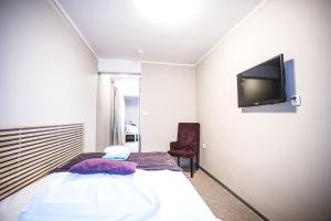 เตียงในห้องที่ Hotel New Wave