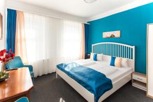 Postel nebo postele na pokoji v ubytování Hotel Condor