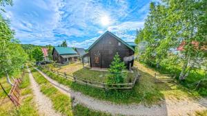 an overhead view of a barn and a house at Cozy Wooden House with Fireplace near Zabljak & Durmitor in Žabljak
