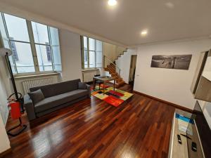 a living room with a couch and a table at MS Piazza del Papa Sea Port in Ancona