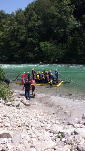 a group of people in a boat on a river at Rafting Camp Apartments Montenegro Goran Lekovic in Žabljak