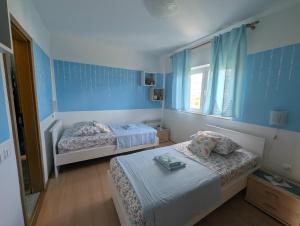 Postel nebo postele na pokoji v ubytování Apartment Sara