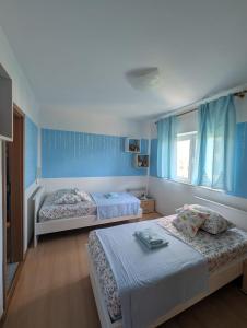 Postel nebo postele na pokoji v ubytování Apartment Sara