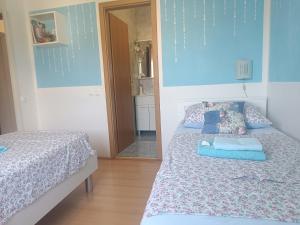 Postel nebo postele na pokoji v ubytování Apartment Sara