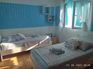 Postel nebo postele na pokoji v ubytování Apartment Sara