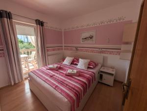 Postel nebo postele na pokoji v ubytování Apartment Sara