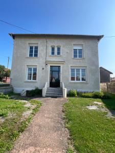 a house with a pathway leading to the front door at Les Croisés&Spa in Azannes-et-Soumazannes