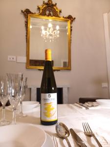 a bottle of wine sitting on top of a table at CAVOUR257 in La Spezia