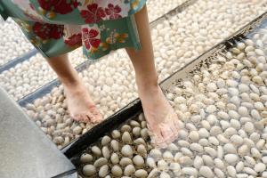 a woman in a dress standing on a pile of balls at Dogo Kan in Matsuyama +34 photos