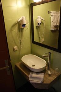 Phòng tắm tại Aposperides Hotel