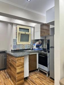 a kitchen with a counter top and a stove at LuXURY STUDIOS MATROUH 2 in Marsa Matruh