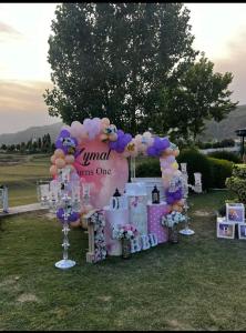 a set up for a wedding with balloons and a sign at lake view hotel and resort in Khānpur