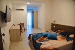 Телевизор и/или развлекательный центр в La Candela Affittacamere