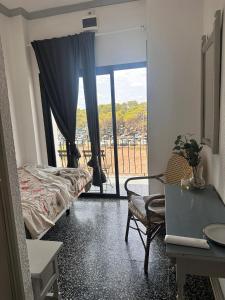 Voodi või voodid majutusasutuse Hostal Flamingo by Nest toas