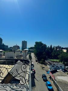 a city street with cars parked in a parking lot at Hotel Black Sea Kobuleti in Kobuleti +52 photos