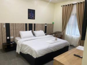 Postel nebo postele na pokoji v ubytování Victia Suite and Lounge