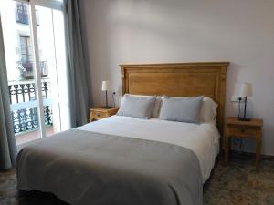 Llit o llits en una habitació de Hostal Portofino