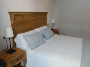 Llit o llits en una habitació de Hostal Portofino