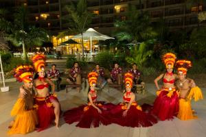 a group of people dressed up in colorful costumes at Nouvata in Noumea