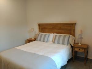 Llit o llits en una habitació de Hostal Portofino
