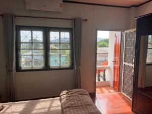 Ένα ή περισσότερα κρεβάτια σε δωμάτιο στο Coastal Haven Homestay