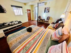 a bedroom with two beds and a cat sitting on the bed at Chen in Ezuz - Adults Only in ‘Ezuz