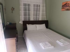 Кровать или кровати в номере Rinio Sea House
