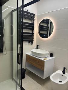 a bathroom with a sink and a toilet and a mirror at Borgo Albergo Museum XIV in Melfi +39 photos