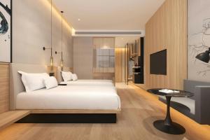 A bed or beds in a room at Fairfield by Marriott Shanghai Hongqiao