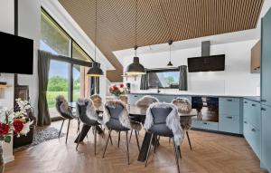 a dining room with a table and chairs at 3 Bedroom Awesome Home In Tarm - P52739 in Tarm