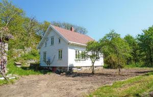 a white house with a red roof at 4 Bedroom Cozy Home In Mandal - Nvk242 in Ime