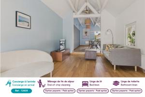 a living room with a bed and a couch at Maison avec terrasse et jardin à la Baule pour 6 in La Baule