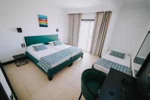 Ένα ή περισσότερα κρεβάτια σε δωμάτιο στο HOTEL KAISER