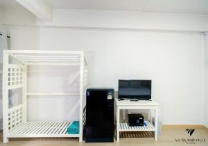 a room with a refrigerator next to a bunk bed at THE HABITAT Koh Chang - VJ Island View in Ko Chang