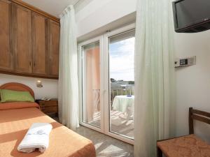 Postel nebo postele na pokoji v ubytování Hotel Mayflower