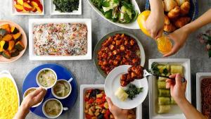 a group of people eating food on a table at Toyoko Inn Tokyo Minowa-eki in Tokyo