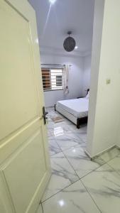 Postel nebo postele na pokoji v ubytování Dahlia appartement RDC - 2 Chambres - Lomé