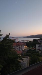 a view of a city with the ocean in the background at Guest House Emi in Balchik