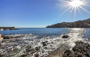 a view of a body of water with the sun at 2 Bedroom Nice Home In Port Vendres - Flp294 in Port-Vendres