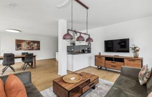 a living room with a couch and a table at Gebirgsresort Winterberg in Winterberg