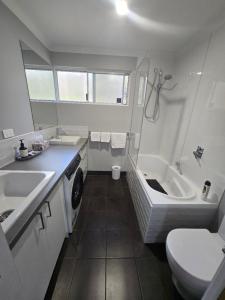 a bathroom with a sink and a tub and a toilet at 75 Peace Street in Denmark +84 photos