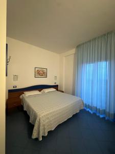 Postel nebo postele na pokoji v ubytování Albergo Godenizzo