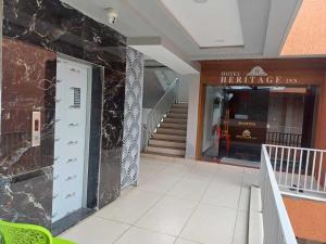 a building with a entrance to a fire place at Hotel O Heritage Inn in Mehsāna
